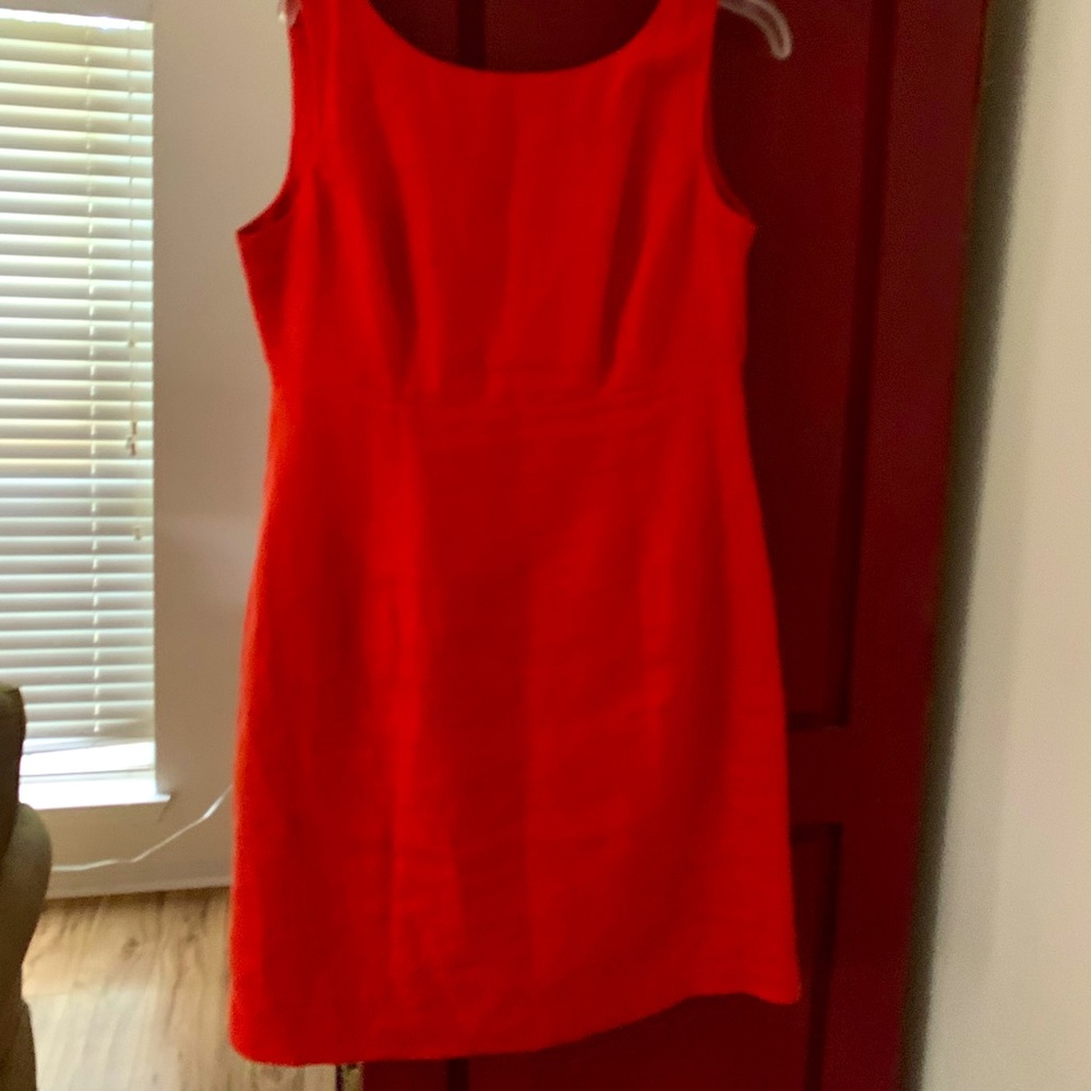 Love this dress!! Coral buttons in back side zipper.